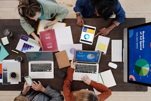 Group of people working around a table